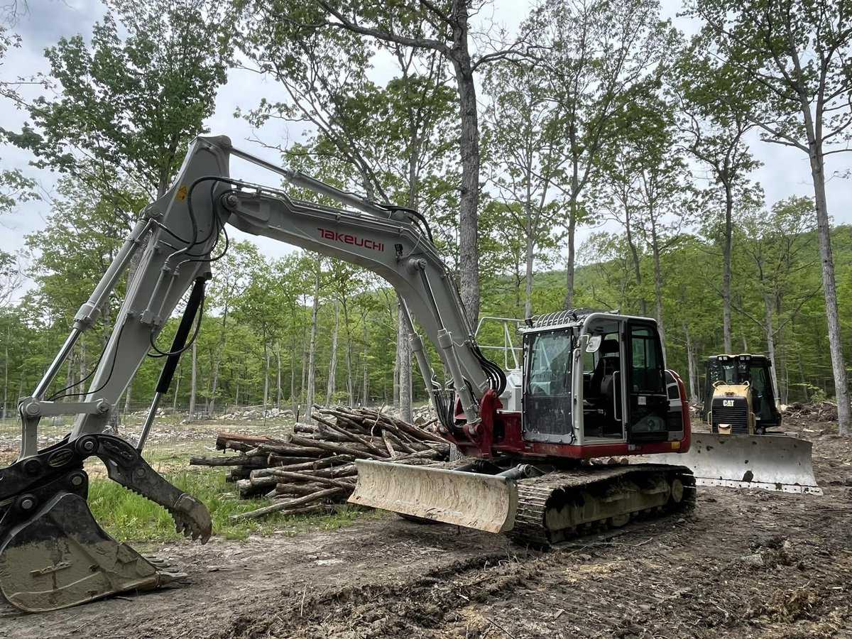 side view of land clearing vehicles